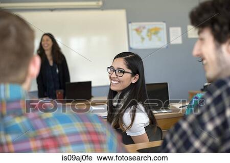 Stock Image - University students in classroom. Fotosearch