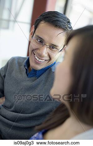 Young man wearing glasses, smiling View Large Photo Image Stock Image - Young man wearing glasses, smiling. Fotosearch