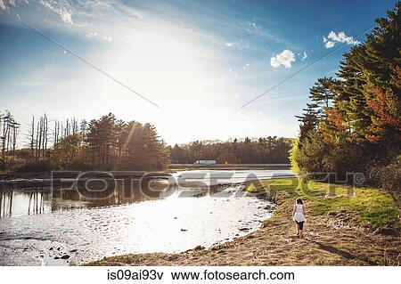 Young woman at beach in Kittery, Maine, USA View Large Photo Image Stock Photo - Young woman at beach in Kittery, Maine, USA. Fotosearch