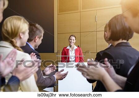 Audience applauding young businesswoman in conference room View Large Photo Image Stock Photography - Audience applauding young businesswoman in conference room. Fotosearch