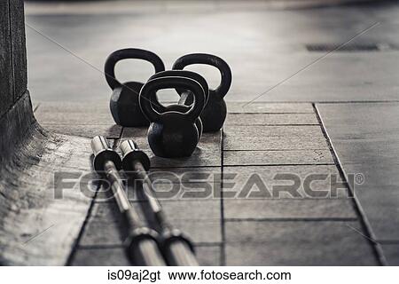 Barbell and kettlebell weights View Large Photo Image Stock Photograph - Barbell and kettlebell weights. Fotosearch