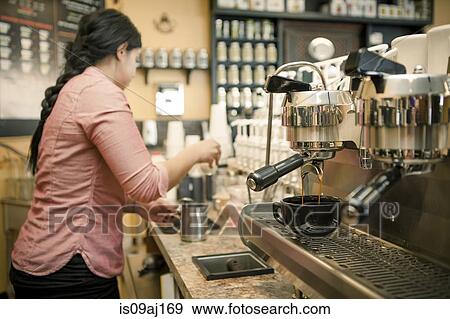 Barista busy with espresso machine in cafe View Large Photo Image Stock Photo - Barista busy with espresso machine in cafe. Fotosearch