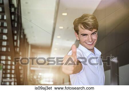 Businessman giving the thumbs-up View Large Photo Image Stock Photograph - Businessman giving the thumbs-up. Fotosearch
