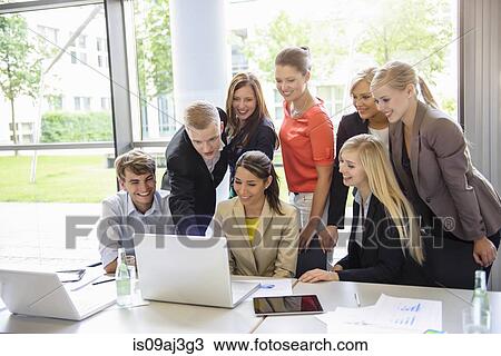 Businessmen and businesswomen at brainstorming meeting View Large Photo Image Stock Image - Businessmen and businesswomen at brainstorming meeting. Fotosearch