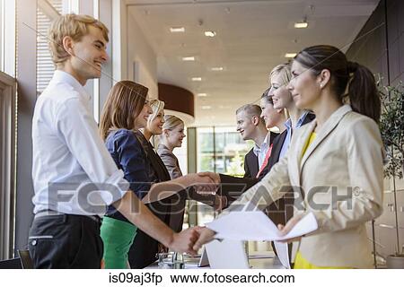 Businessmen and businesswomen at brainstorming meeting View Large Photo Image Stock Photography - Businessmen and businesswomen at brainstorming meeting. Fotosearch