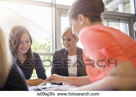 Businesswoman at meeting View Large Photo Image Stock Photograph - Businesswoman at meeting. Fotosearch
