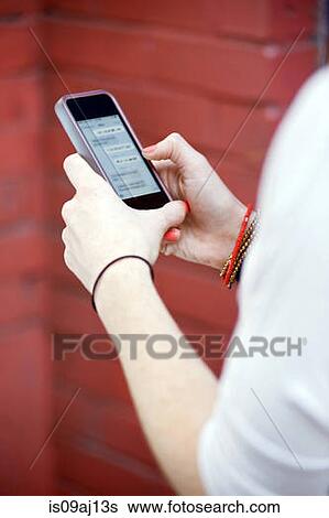 Close up of young woman's hands texting on smartphone View Large Photo Image Stock Photograph - Close up of young woman's hands texting on smartphone. Fotosearch