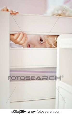 Close up portrait of four year old boy peeking through bed frame View Large Photo Image Stock Photo - Close up portrait of four year old boy peeking through bed frame. Fotosearch