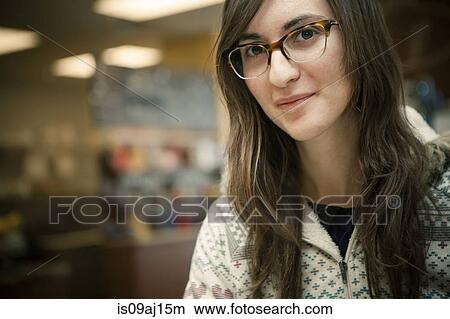 Picture - Close up portrait of mid adult woman in cafe. Fotosearch