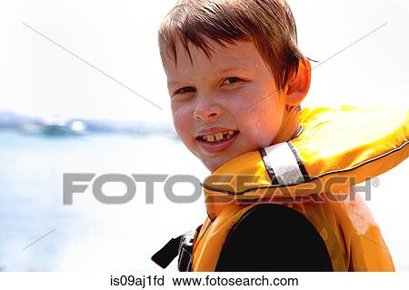 Close up portrait of smiling boy in lifejacket View Large Photo Image Stock Image - Close up portrait of smiling boy in lifejacket. Fotosearch