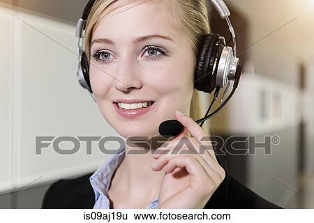 Close up portrait of young businesswoman using telephone headset View Large Photo Image Stock Photograph - Close up portrait of young businesswoman using telephone headset. Fotosearch