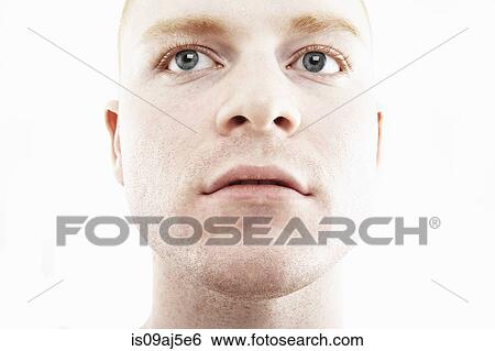 Stock Photograph - Close up studio portrait of young man. Fotosearch