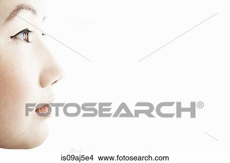 Picture - Close up studio profile of young woman. Fotosearch