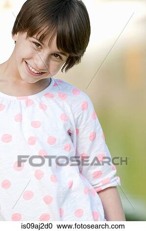 Cropped portrait of shy ten year old girl View Large Photo Image Stock Image - Cropped portrait of shy ten year old girl. Fotosearch