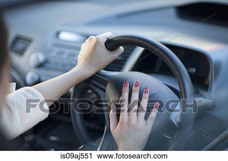 Cropped view of young businesswoman's hands pressing car horn View Large Photo Image Stock Image - Cropped view of young businesswoman's hands pressing car horn. Fotosearch