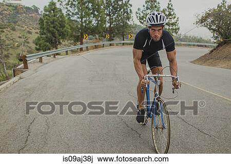 Cyclist on uphill road View Large Photo Image Stock Image - Cyclist on uphill road. Fotosearch