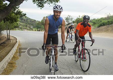 Cyclists on uphill road View Large Photo Image Stock Image - Cyclists on uphill road. Fotosearch