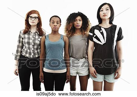 Picture - Formal studio portrait of four serious young women. Fotosearch