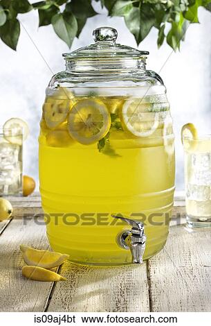 Glass barrel with tap dispenser containing fresh lemonade drink View Large Photo Image Stock Photograph - Glass barrel with tap dispenser containing fresh lemonade drink. Fotosearch
