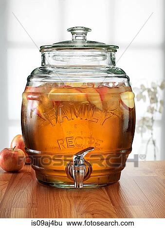 Glass barrel with tap dispenser containing fresh apple drink View Large Photo Image Stock Photograph - Glass barrel with tap dispenser containing fresh apple drink. Fotosearch
