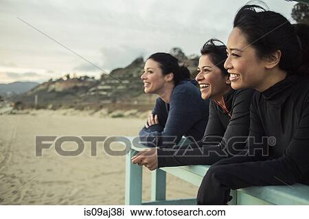 Joggers enjoying view on beach View Large Photo Image Stock Image - Joggers enjoying view on beach. Fotosearch