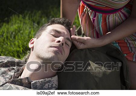 Overhead close up view of anxious male soldier with wife soothing his forehead in garden View Large Photo Image Stock Image - Overhead close up view of anxious male soldier with wife soothing his forehead in garden. Fotosearch