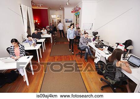 People at work in busy modern office View Large Photo Image Picture - People at work in busy modern office. Fotosearch