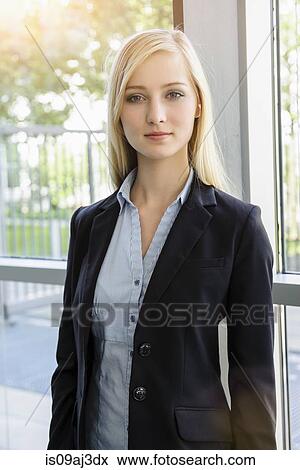 Portrait of ambitious young businesswoman in office View Large Photo Image Stock Photo - Portrait of ambitious young businesswoman in office. Fotosearch