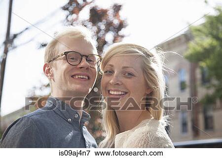 Portrait of happy young couple on street View Large Photo Image Stock Photo - Portrait of happy young couple on street. Fotosearch