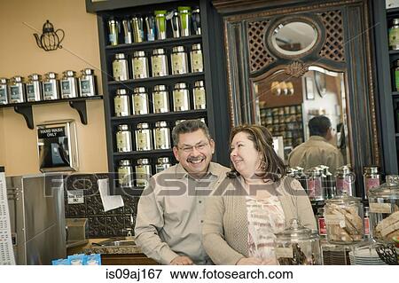 Portrait of mature cafe owning couple in cafe kitchen View Large Photo Image Stock Photo - Portrait of mature cafe owning couple in cafe kitchen. Fotosearch