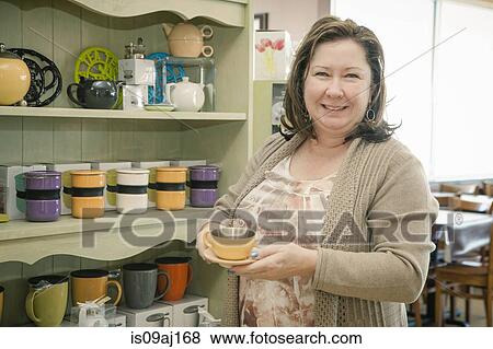 Portrait of mature female business owner in cafe View Large Photo Image Stock Photo - Portrait of mature female business owner in cafe. Fotosearch
