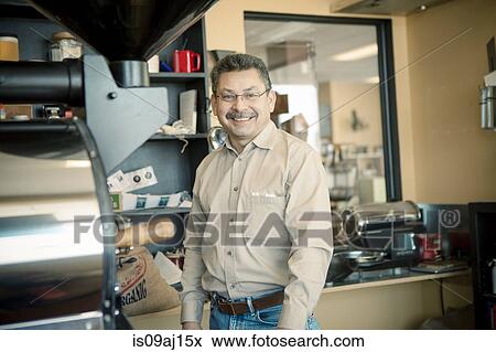 Stock Photo - Portrait of mature male business owner in cafe. Fotosearch
