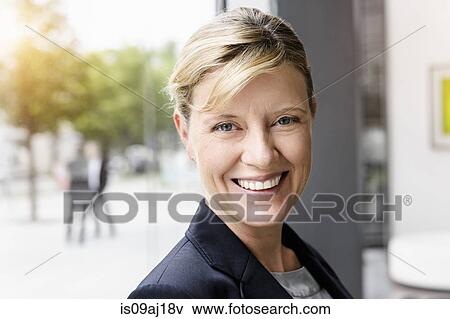 Portrait of smiling mature businesswoman View Large Photo Image Stock Photo - Portrait of smiling mature businesswoman. Fotosearch