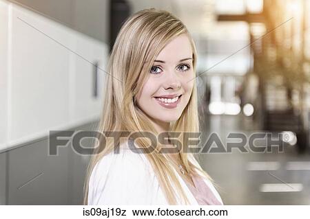 Stock Photo - Portrait of smiling young businesswoman. Fotosearch
