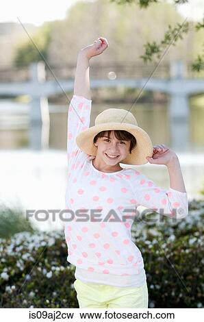 Portrait of ten year old girl with hand raised View Large Photo Image Stock Photo - Portrait of ten year old girl with hand raised. Fotosearch