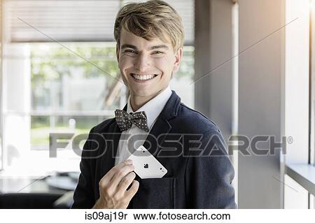Portrait of young businessman with an ace playing card in pocket View Large Photo Image Stock Photography - Portrait of young businessman with an ace playing card in pocket. Fotosearch