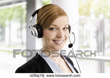 Portrait of young businesswoman in telephone headset View Large Photo Image Stock Image - Portrait of young businesswoman in telephone headset. Fotosearch