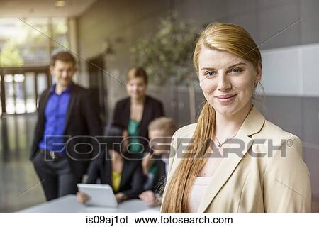 Portrait of young businesswoman in office View Large Photo Image Stock Photograph - Portrait of young businesswoman in office. Fotosearch