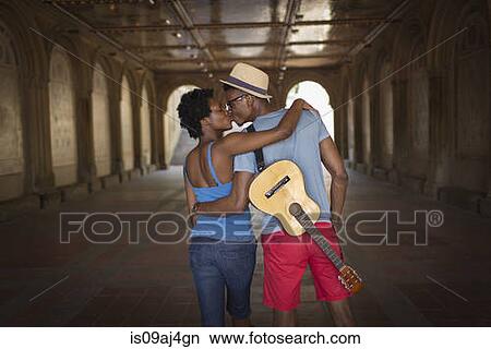 Rear view of young couple with mandolin in Bethesda Terrace arcade, Central Park, New York City, USA View Large Photo Image Picture - Rear view of young couple with mandolin in Bethesda Terrace arcade, Central Park, New York City, USA. Fotosearch