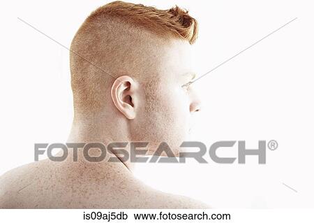 Stock Image - Rear view studio portrait of young man. Fotosearch