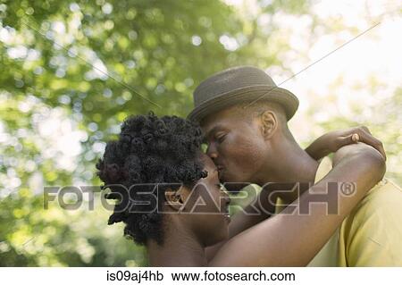 Romantic young couple in park View Large Photo Image Stock Image - Romantic young couple in park. Fotosearch