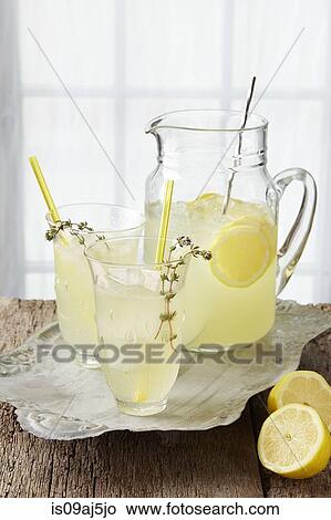 Sparkling thyme lemonade, with fresh lemon, thyme infused syrup and sparkling water View Large Photo Image Picture - Sparkling thyme lemonade, with fresh lemon, thyme infused syrup and sparkling water. Fotosearch
