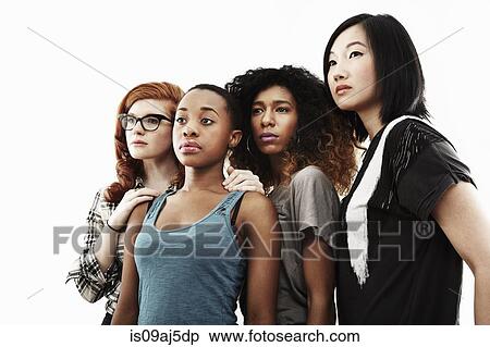 Studio portrait of four serious young women View Large Photo Image Stock Photography - Studio portrait of four serious young women. Fotosearch