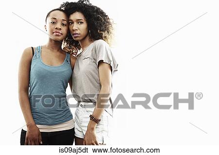 Studio portrait of two young women View Large Photo Image Stock Photograph - Studio portrait of two young women. Fotosearch