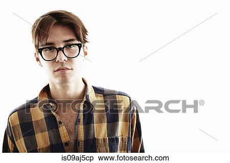 Stock Photography - Studio portrait of young man in eyeglasses. Fotosearch
