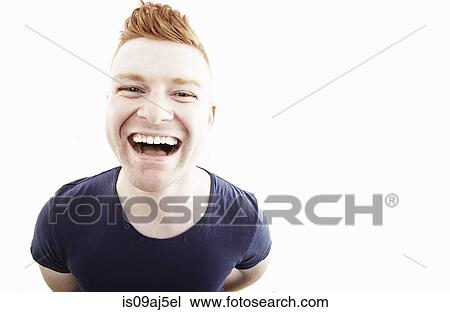 Studio portrait of young man laughing View Large Photo Image Stock Image - Studio portrait of young man laughing. Fotosearch