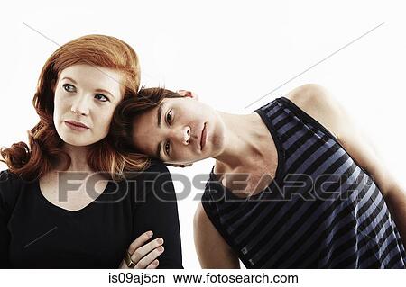 Studio portrait of young man leaning on young woman's shoulder View Large Photo Image Picture - Studio portrait of young man leaning on young woman's shoulder. Fotosearch