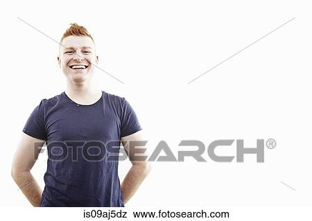 Stock Photo - Studio portrait of young man smiling. Fotosearch