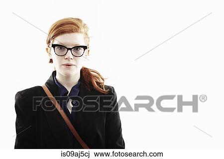 Studio portrait of young woman with eyeglasses and blank expression View Large Photo Image Stock Image - Studio portrait of young woman with eyeglasses and blank expression. Fotosearch