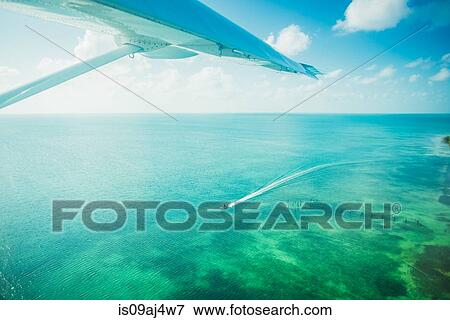 Stock Photo - View of ocean from plane, San Pedro, Belize. Fotosearch